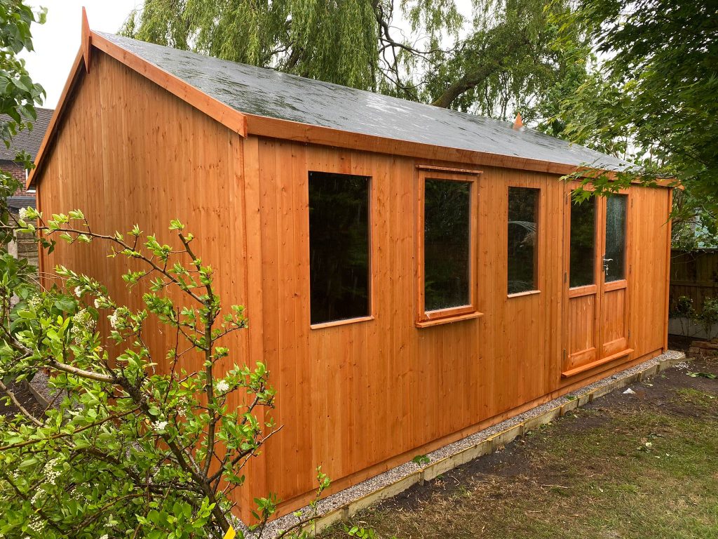 THIS IS A VERY TALL SUMMERHOUSE AND WORKSHOP ASSEMBLED IN CHESHIRE BY LANCASHIRE SUMMERHOUSES