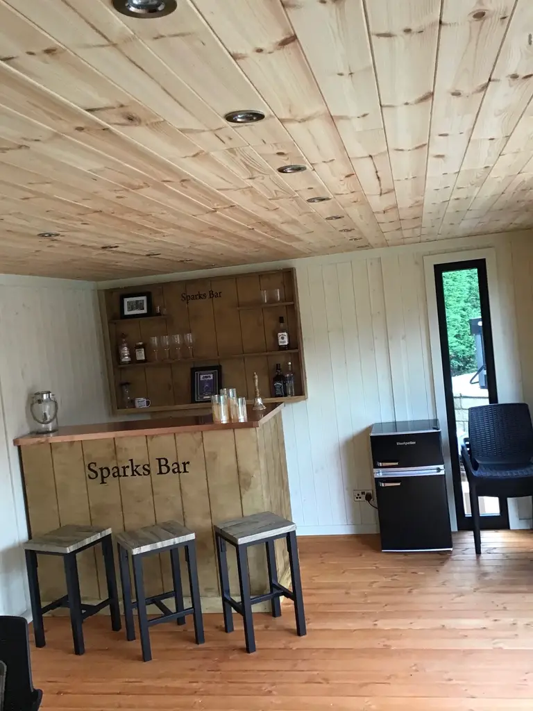 THIS IS A GARDEN OFFICE MADE FROM WESTERN RED CEDAR
