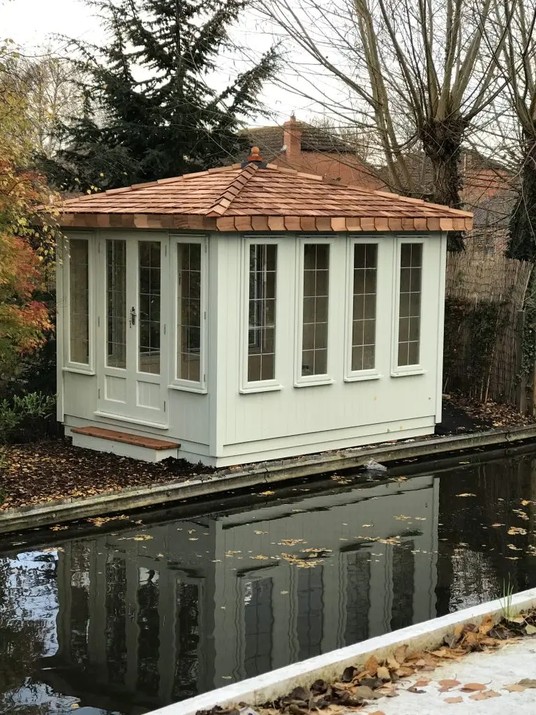 THIS IS OUR HAND BUILT ANTIGUA SUMMERHOUSE WITH A VAULTED CEDAR ROOF FULLY LINED AND INSULATED WITH EXTERIOR PAINTWORK IN LIGHT GREEN