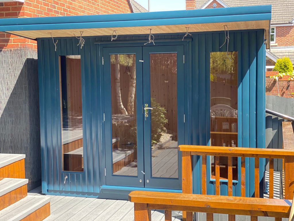 BLUE COLOUR CONTEMPORARY SUMMERHOUSE WITH LONG WINDOWS