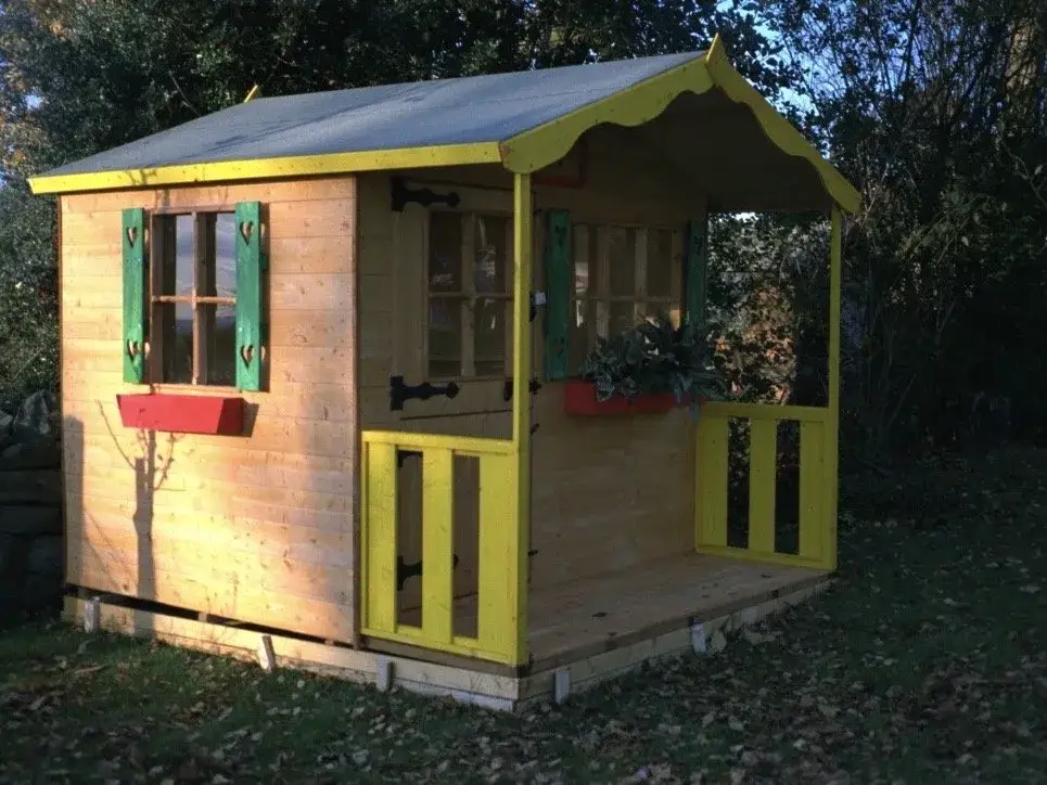 CHILDS PLAY HOUSE WITH A PAINTED VERANDAH
