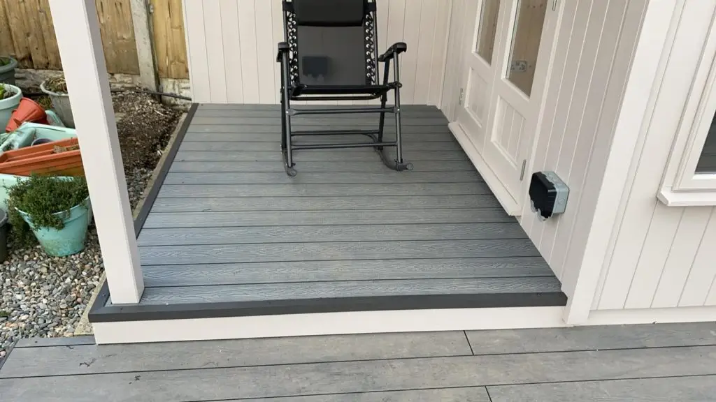 Photo shows covered seating area of this summerhouse